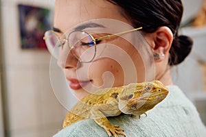 Beautiful Woman Posing with Her Adorable Bearded Dragon Pets