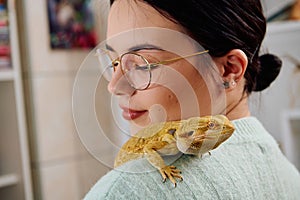 Beautiful Woman Posing with Her Adorable Bearded Dragon Pets