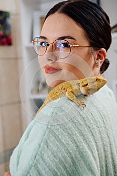 Beautiful Woman Posing with Her Adorable Bearded Dragon Pets