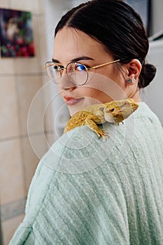 Beautiful Woman Posing with Her Adorable Bearded Dragon Pets