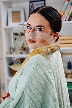 Beautiful Woman Posing with Her Adorable Bearded Dragon Pets