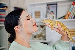 Beautiful Woman Posing with Her Adorable Bearded Dragon Pets