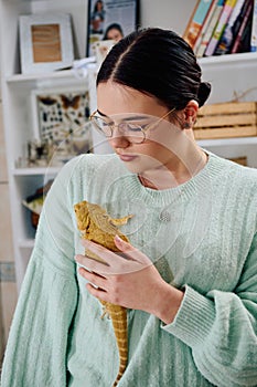 Beautiful Woman Posing with Her Adorable Bearded Dragon Pets