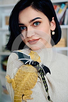 Beautiful Woman Posing with Her Adorable Bearded Dragon Pets