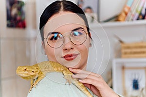 Beautiful Woman Posing with Her Adorable Bearded Dragon Pets