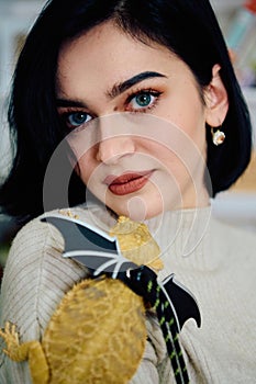 Beautiful Woman Posing with Her Adorable Bearded Dragon Pets