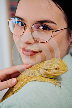 Beautiful Woman Posing with Her Adorable Bearded Dragon Pets