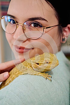 Beautiful Woman Posing with Her Adorable Bearded Dragon Pets