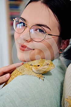 Beautiful Woman Posing with Her Adorable Bearded Dragon Pets