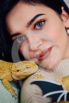 Beautiful Woman Posing with Her Adorable Bearded Dragon Pets