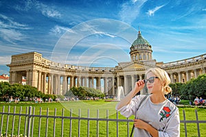 Beautiful woman posing over Kazan Cathedral in St. Petersburg