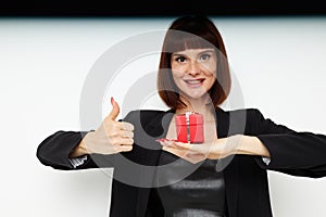 beautiful woman posing with red gift box surprise  background