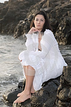 Beautiful woman posing on the rocks