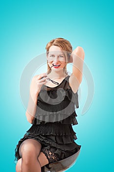 A beautiful woman posing and smiling coquettishly