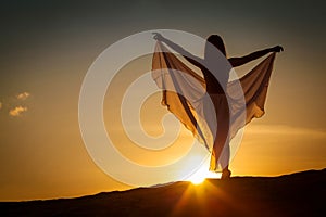 Beautiful woman posing at sunset