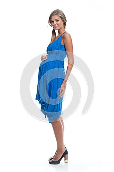 Beautiful Woman Pregnant model in blue dress on white isolated background posing. Clothes for pregnant women