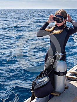 Beautiful Woman in Preparation for Scuba Diving