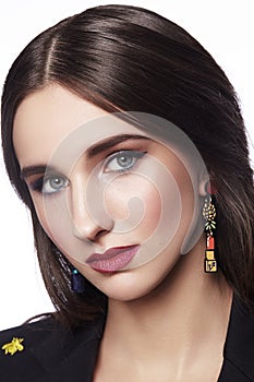 Beautiful Woman with Professional Makeup. Celebrate Style Eye Make-up, Perfect Eyebrows, Shine Skin. Bright Fashion Look