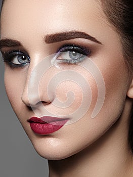 Beautiful Woman with Professional Makeup. Celebrate Style Eye Make-up, Perfect Eyebrows, Shine Skin. Bright Fashion Look