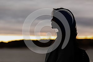 Beautiful woman profile silhouette portrait with crescent moon in her head