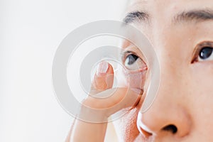 Beautiful Woman Putting Eye Lenses With Hands