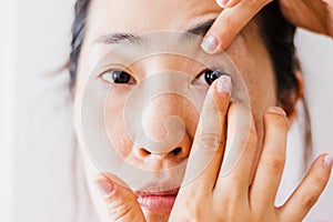 Beautiful Woman Putting Eye Lenses With Hands