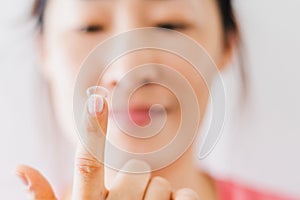 Beautiful Woman Putting Eye Lenses With Hands