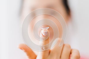 Beautiful Woman Putting Eye Lenses With Hands