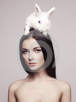 Beautiful woman with rabbit