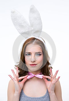 Beautiful woman in rabbit ears holding her butterfly