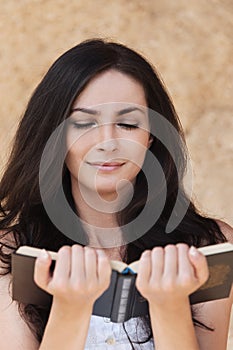 Beautiful woman reading book