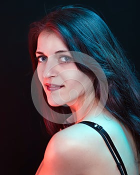 Beautiful woman in red and blue light