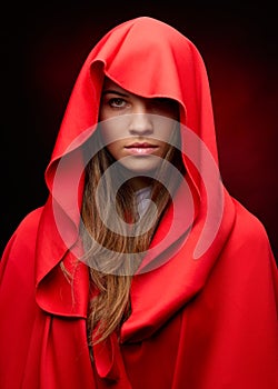 Beautiful woman with red cloak photo