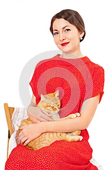 Beautiful woman in red dress with a cat