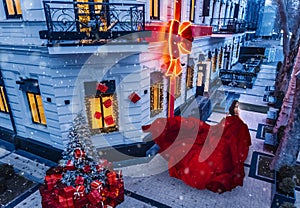 Beautiful woman in red dress in christmas portrait beauty portrait photoshoot