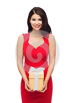 Beautiful woman in red dress with gift box