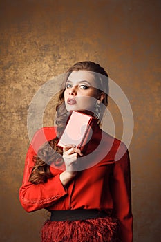 beautiful woman in red dress holding purse