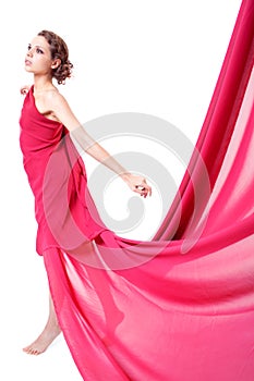 Beautiful woman in red flying dress
