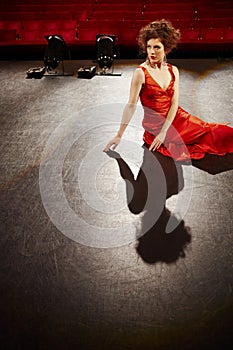 Beautiful Woman In Red Gown On Stage