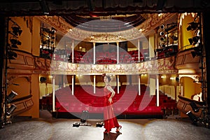 Beautiful Woman In Red Gown On Stage