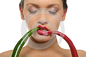 Beautiful woman with red and green peppers