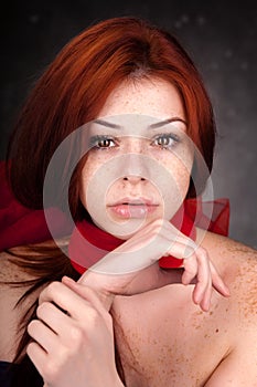 Beautiful woman with red hair and freckles