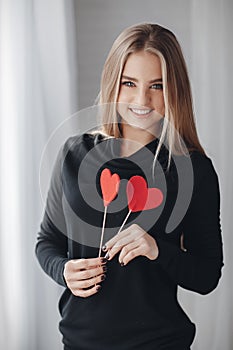 Beautiful woman with red hearts in love day