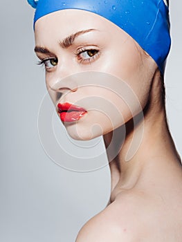 Beautiful woman red lip blue swimming cap diving model