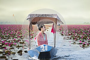 Beautiful woman with the red lotus sea