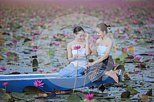 Beautiful woman with the red lotus sea
