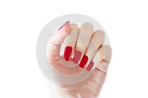 Beautiful Woman Red Nail. Female Hand with Red Nails Manicure Isolated On White Wall Background