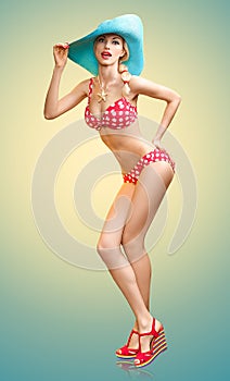 Beautiful woman in red polka dots fashionable swimsuit. PinUp