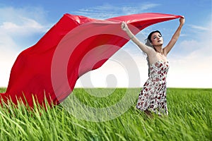 Beautiful woman with red scarf outdoor