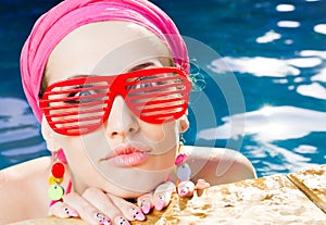 Beautiful woman with red sunglasses